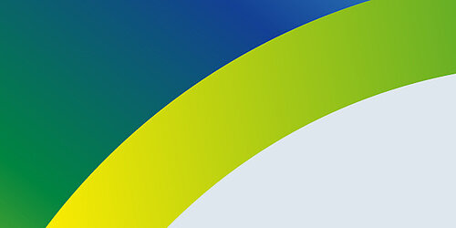 grüne, blaue und gelbe Formen vor grauem Hintergrund